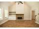 Living room with stone fireplace and built-in shelving at 1150 Sweet Mia Ln, Powder Springs, GA 30127