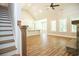 Elegant staircase with wooden handrail leading to upper level at 1150 Sweet Mia Ln, Powder Springs, GA 30127