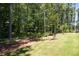 Spacious lot with mature trees and a split rail fence at 1150 Sweet Mia Ln, Powder Springs, GA 30127