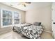 Comfortable bedroom with two twin beds, natural light, and neutral decor at 1120 Constitution Way, Cumming, GA 30040