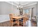 Formal dining room featuring hardwood floors, decorative molding, and natural light at 1120 Constitution Way, Cumming, GA 30040