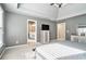 Serene main bedroom with a tray ceiling, tv, and an en-suite bathroom entrance at 1120 Constitution Way, Cumming, GA 30040