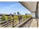 A spacious balcony features brick floors and railings with city views at 750 Park Ne Ave # 8E, Atlanta, GA 30326