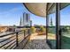 Enjoy city views from this condo balcony with brick flooring and sleek railing at 750 Park Ne Ave # 8E, Atlanta, GA 30326
