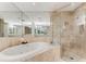 Spa-like bathroom with soaking tub, glass shower, and luxurious finishes throughout at 750 Park Ne Ave # 8E, Atlanta, GA 30326