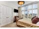 Cozy bedroom with lots of natural light coming in from the large window at 750 Park Ne Ave # 8E, Atlanta, GA 30326