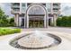 Building entryway with a grand archway, fountain and meticulously maintained landscaping at 750 Park Ne Ave # 8E, Atlanta, GA 30326