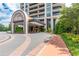 Luxury building entrance with circular driveway and walkway at 750 Park Ne Ave # 8E, Atlanta, GA 30326