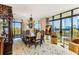 Elegantly furnished dining room with a large window, chandelier, and luxury furniture at 750 Park Ne Ave # 8E, Atlanta, GA 30326