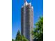 Exterior view of a modern high-rise building with wrap-around balconies at 750 Park Ne Ave # 8E, Atlanta, GA 30326