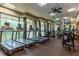 Modern fitness center equipped with treadmills, weights, and large windows offering scenic views at 750 Park Ne Ave # 8E, Atlanta, GA 30326