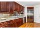 Kitchen featuring stainless steel refrigerator, granite countertops and custom cabinets at 750 Park Ne Ave # 8E, Atlanta, GA 30326