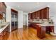 Kitchen featuring stainless steel refrigerator, custom cabinetry, and hardwood floors at 750 Park Ne Ave # 8E, Atlanta, GA 30326