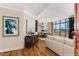 Sun-filled living room and dining area with beautiful hardwood floors and elegant chandelier at 750 Park Ne Ave # 8E, Atlanta, GA 30326
