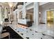 Grand lobby features marble floors, elegant columns, and a reception desk with a fireplace and gold elevators at 750 Park Ne Ave # 8E, Atlanta, GA 30326