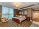 Elegant main bedroom with large bed and sitting chair at 750 Park Ne Ave # 8E, Atlanta, GA 30326