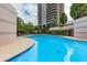 An inviting pool area with lounging chairs and shade, ideal for relaxing with a view of the building at 750 Park Ne Ave # 8E, Atlanta, GA 30326