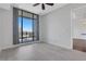 Bedroom with hardwood floors and access to balcony and kitchen at 565 Peachtree Ne St # 1509, Atlanta, GA 30308