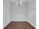 Empty dining room with hardwood floors and chandelier at 565 Peachtree Ne St # 1509, Atlanta, GA 30308