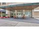 Building entrance with covered canopy and landscaping at 565 Peachtree Ne St # 1509, Atlanta, GA 30308