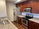 Modern kitchen with stainless steel appliances and granite countertops at 565 Peachtree Ne St # 1509, Atlanta, GA 30308