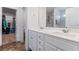 Bright bathroom with double sinks and access to closet at 248 Hamilton Pointe Dr, Mcdonough, GA 30253