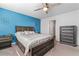 Spacious bedroom with dresser and ceiling fan at 248 Hamilton Pointe Dr, Mcdonough, GA 30253