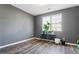 Simple bedroom with grey walls and wood-look flooring at 248 Hamilton Pointe Dr, Mcdonough, GA 30253