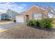 Two-story home with a brick facade and partially landscaped yard at 248 Hamilton Pointe Dr, Mcdonough, GA 30253