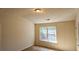 Bright bedroom with neutral walls and carpeting at 420 Berckman Nw Dr, Lilburn, GA 30047