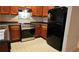 Kitchen features stainless steel range and black refrigerator at 420 Berckman Nw Dr, Lilburn, GA 30047