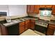 Well-equipped kitchen, featuring dark countertops and dishwasher at 420 Berckman Nw Dr, Lilburn, GA 30047