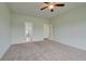 Neutral bedroom with a ceiling fan and soft carpet at 173 Haverling Pass, Hampton, GA 30228