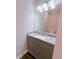 Well-lit bathroom features a gray vanity with a granite countertop and white vessel sink at 2005 Ocean Nw Dr, Atlanta, GA 30318