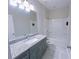Bathroom featuring gray vanity with granite countertop and tile floors at 2005 Ocean Nw Dr, Atlanta, GA 30318