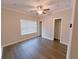 Bright bedroom with ceiling fan, hardwood floors, window, and closet at 2005 Ocean Nw Dr, Atlanta, GA 30318