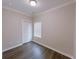 Bright bedroom with hardwood floors, a window, and a closet with white doors at 2005 Ocean Nw Dr, Atlanta, GA 30318