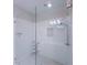 Modern walk-in shower with white subway tile, a built-in niche, and a rainfall shower head at 2005 Ocean Nw Dr, Atlanta, GA 30318