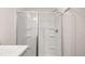 Bathroom showing a glass shower with built-in shelves and modern fixtures at 491 Reflection Dr # 33, Stockbridge, GA 30281