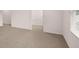 A bright bedroom with neutral carpet and a window for natural light at 491 Reflection Dr # 33, Stockbridge, GA 30281