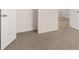 Hallway featuring plush carpeting and crisp white paint, connecting various rooms in the home at 491 Reflection Dr # 33, Stockbridge, GA 30281
