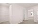 Upstairs hallway with a closet on the left and two bedrooms visible from the vantage point at 491 Reflection Dr # 33, Stockbridge, GA 30281