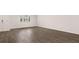 Spacious living room featuring sleek wood flooring and a door to the exterior at 491 Reflection Dr # 33, Stockbridge, GA 30281