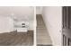 Bright living space featuring an open layout leading into a modern kitchen with white cabinetry at 491 Reflection Dr # 33, Stockbridge, GA 30281
