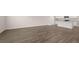 Expansive living space with stylish wood flooring and an open view of the modern kitchen at 491 Reflection Dr # 33, Stockbridge, GA 30281