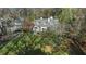 Aerial view of a home with a large yard and mature trees at 1225 W Wesley Nw Rd, Atlanta, GA 30327