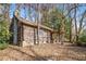 Rustic log cabin nestled in a wooded setting at 1225 W Wesley Nw Rd, Atlanta, GA 30327