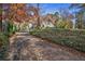 Long driveway leading to a charming home with landscaping at 1225 W Wesley Nw Rd, Atlanta, GA 30327