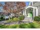 Front entry with green door, stone steps, and landscaping at 1225 W Wesley Nw Rd, Atlanta, GA 30327