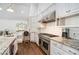 Large kitchen with stainless steel appliances and granite countertops at 1225 W Wesley Nw Rd, Atlanta, GA 30327